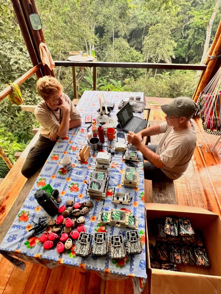 Shawn McCracken at balcony table with gear